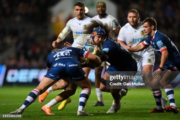 Jack Nowell of Exeter Chiefs takes on Jake Kerr and Chris Vui of Bristol Rugby during the Gallagher Premiership Rugby match between Bristol Bears and...