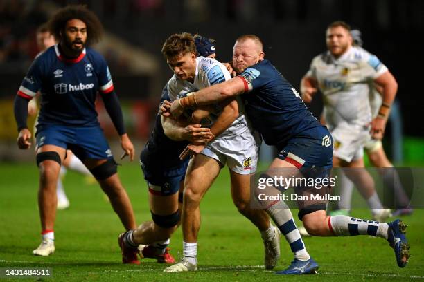Sam Maunder of Exeter Chiefs is tackled by Joe Joyce and Magnus Bradbury of Bristol Rugby during the Gallagher Premiership Rugby match between...