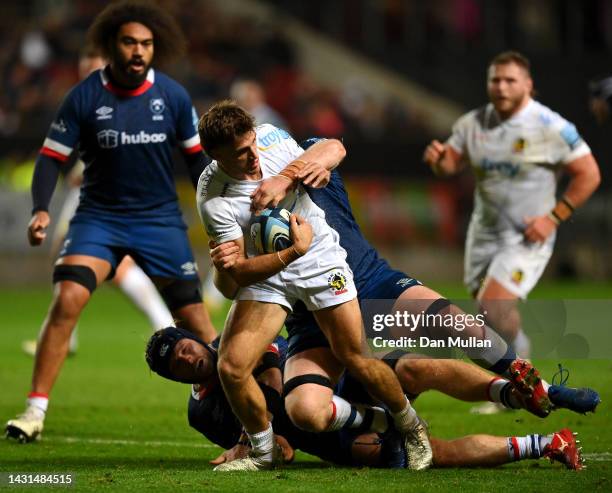 Sam Maunder of Exeter Chiefs is tackled by Joe Joyce and Magnus Bradbury of Bristol Rugby during the Gallagher Premiership Rugby match between...
