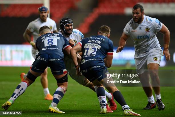 Ruben van Heerden of Exeter Chiefs is tackled by Magnus Bradbury and Sam Bedlow of Bristol Rugby during the Gallagher Premiership Rugby match between...