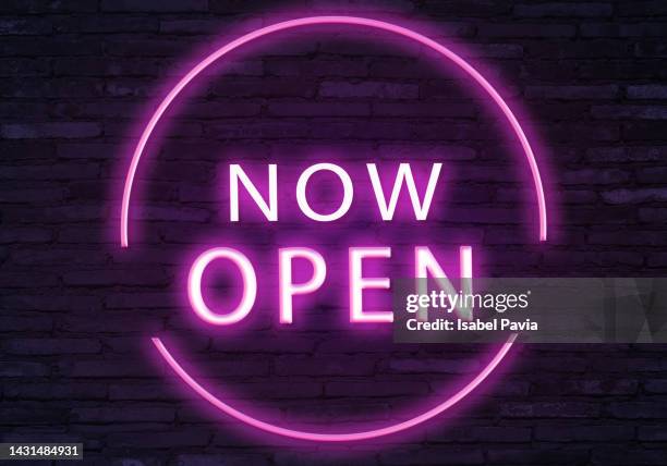 now open message in neon lights - now open for business stock pictures, royalty-free photos & images