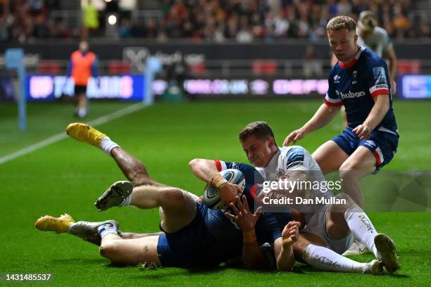 Richard Lane of Bristol Rugby is tackled by Olly Woodburn and Jack Nowell of Exeter Chiefs during the Gallagher Premiership Rugby match between...