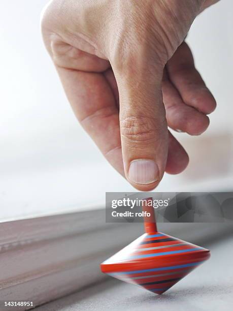 spinning top - spinning top stock pictures, royalty-free photos & images