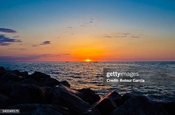 sunset over holland beach - rolour garcia stock pictures, royalty-free photos & images