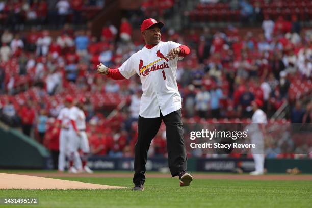 Former player Ozzie Smith throws out the ceremonial first pitch prior to Game One of the NL Wild Card series between the St. Louis Cardinals and the...