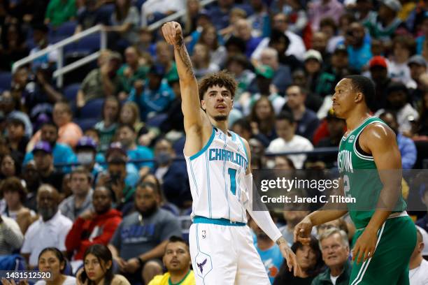 LaMelo Ball of the Charlotte Hornets reacts following a three point basket against Grant Williams of the Boston Celtics during the first quarter of...