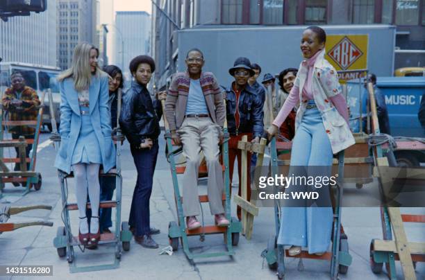 Designer Willi Smith with Toukie Smith and a model in his Digits fall collection. Shot on location in New York's Garment District.