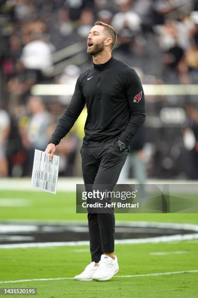 Head coach Kliff Kingsbury interacts with players during warmups before a game against the Las Vegas Raiders at Allegiant Stadium on September 18,...
