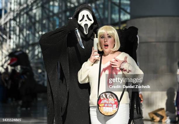 Cosplayers pose as characters from Scream during day 2 of New York Comic Con on October 07, 2022 in New York City.