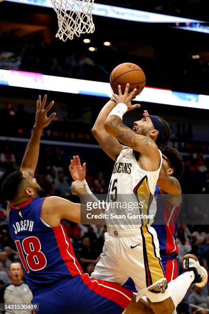 Jose Alvarado of the New Orleans Pelicans shoots over Cory Joseph of the Detroit Pistons during the first quarter of of an NBA preseason game at...
