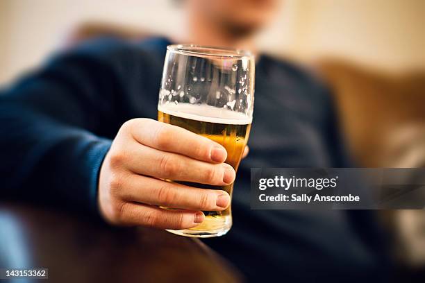 man drinking pint of beer - drink ストックフォトと画像