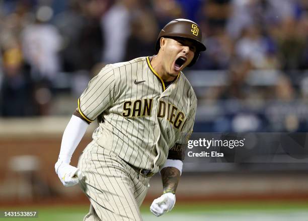 Manny Machado of the San Diego Padres celebrates his solo home run in the fifth inning against the New York Mets during game one of the NL Wild Card...