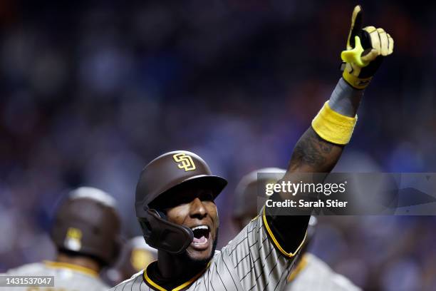 Jurickson Profar of the San Diego Padres reacts after hitting a three-run home run during the fifth inning of Game One of the NL Wild Card Series...