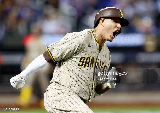 Manny Machado of the San Diego Padres celebrates his solo home run in the fifth inning against the New York Mets during game one of the NL Wild Card...