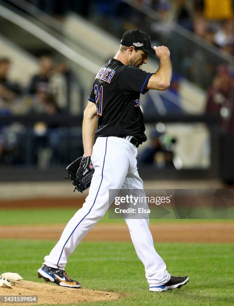 Max Scherzer of the New York Mets reacts after giving up a solo home run to Manny Machado of the San Diego Padres in the fifth inning during game one...