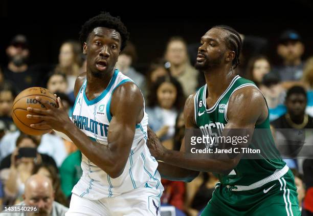 Mark Williams of the Charlotte Hornets posts up against Noah Vonleh of the Boston Celtics during the fourth quarter of the game at Greensboro...