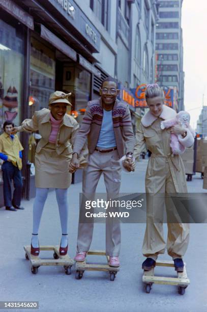 Designer Willi Smith, Toukie Smith and a model pose in the Willi Smith for Digits fall 1972 sportswear collection advance in New York's Garment...