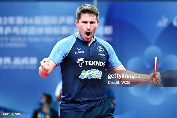 Kristian Karlsson of Sweden reacts against Wang Chuqin of China during the Men's quarter-final match between China and Sweden on Day 8 of 2022 ITTF...