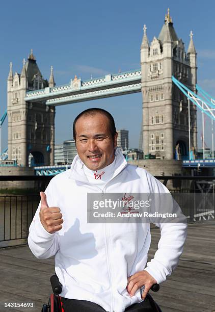 Masazumi Soejima of Japan poses in front of Tower Bridge during a photocall ahead of the Virgin London Marathon 2012 on April 20, 2012 in London,...