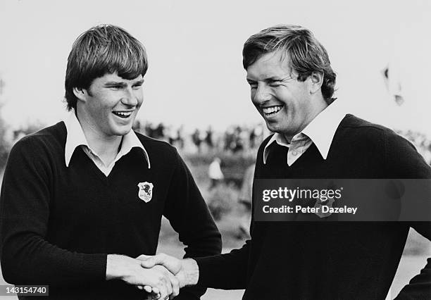 Nick Faldo of England and Peter Oosterhuis of England shake hands after winning their match during the 1977 Ryder Cup at Royal Lytham and St Annes...