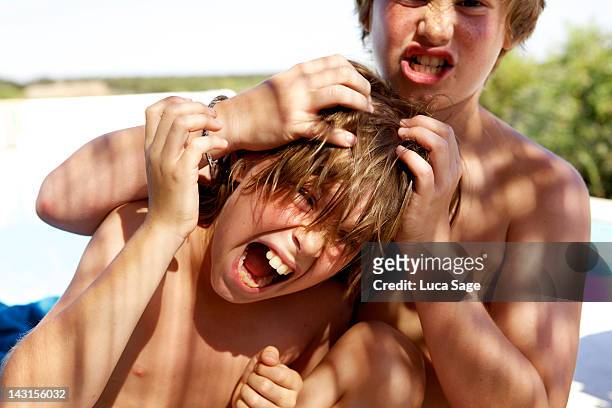 digital vision - child pulling hair stock pictures, royalty-free photos & images