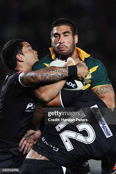 James Tamou of the Kangaroos is hit hard by Issac Luke and Adam Blair of the Kiwis during the ANZAC Test match between the New Zealand Kiwis and the...