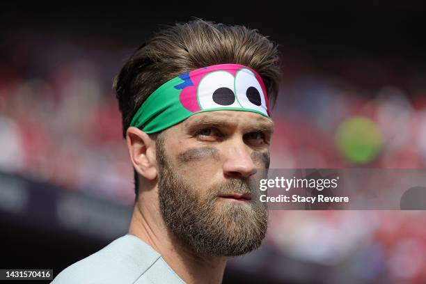 Bryce Harper of the Philadelphia Phillies watches action prior to Game One of the NL Wild Card series against the St. Louis Cardinals at Busch...