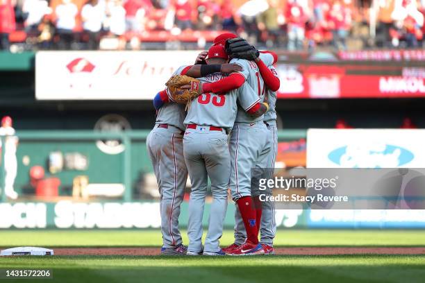 Members of the Philadelphia Phillies celebrate after defeating the St. Louis Cardinals in Game One of the NL Wild Card series a at Busch Stadium on...