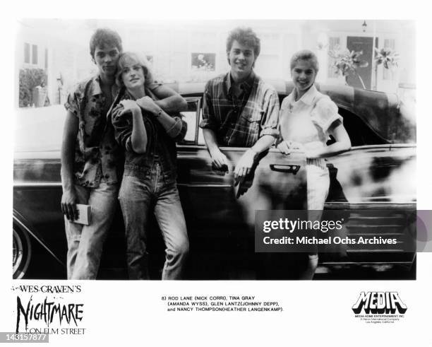Nick Corri, Amanda Wyss, Johnny Depp, and Heather Langenkamp posing beside car in a scene from the film 'A Nightmare On Elm Street', 1984.