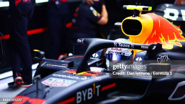 Sergio Perez of Mexico and Oracle Red Bull Racing prepares to drive in the garage during final practice ahead of the F1 Grand Prix of Japan at Suzuka...