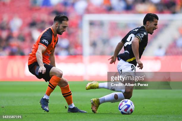 Daniel Arzani of Macarthur is fouled by Jack Hingert of the Roar during the round one A-League Men's match between the Brisbane Roar and Macarthur FC...