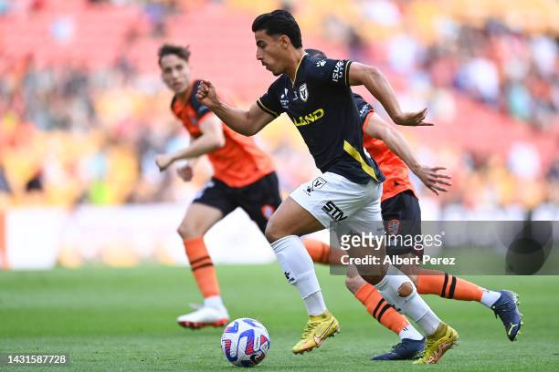 Daniel Arzani of Macarthur dribbles the ball during the round one A-League Men's match between the Brisbane Roar and Macarthur FC at Suncorp Stadium,...