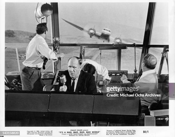 Jesse White in control tower as plane quickly approaches it in a scene from the film 'It's A Mad Mad Mad Mad World', 1963.