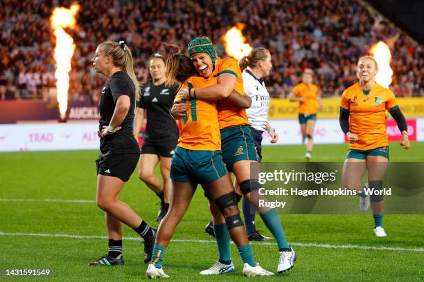 Ivania Wong of Australia celebrates scoring a try with Emily Chancellor of Australia during the Pool A Rugby World Cup 2021 New Zealand match between...