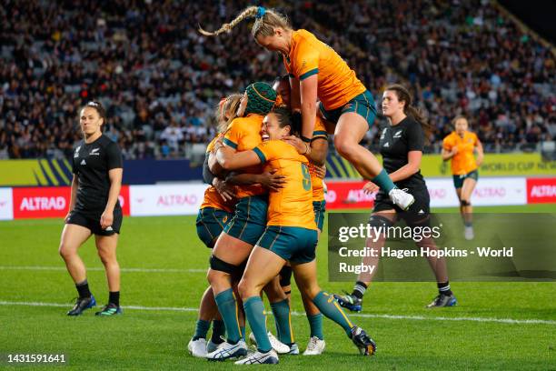 Ivania Wong of Australia celebrates scoring a try with teammates during the Pool A Rugby World Cup 2021 New Zealand match between Australia and New...