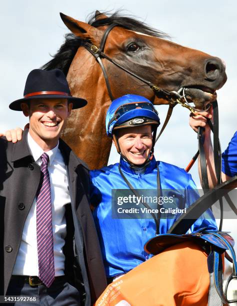 James McDonald poses with Trainer James Cummings and connections after riding Golden Mile to win Race 8, the Neds Caulfield Guineas, during Caulfield...