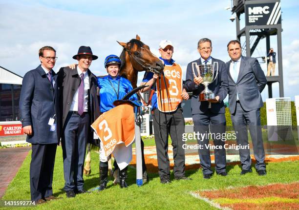 James McDonald poses with Trainer James Cummings and connections after riding Golden Mile to win Race 8, the Neds Caulfield Guineas, during Caulfield...