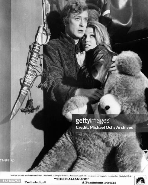 Michael Caine holding onto Margaret Blye in a scene from the film 'The Italian Job', 1969.