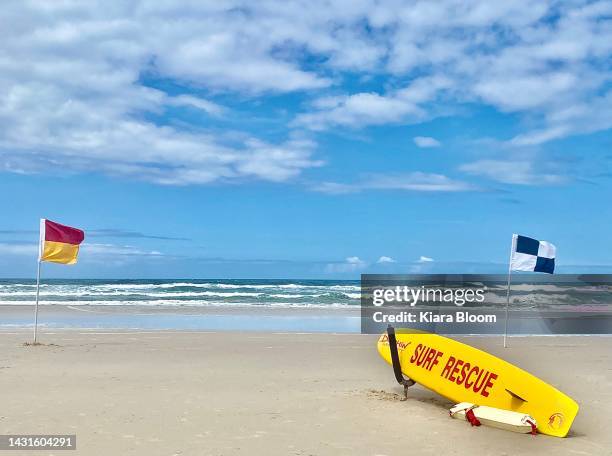 swim between beach flags - surf rescue stock pictures, royalty-free photos & images