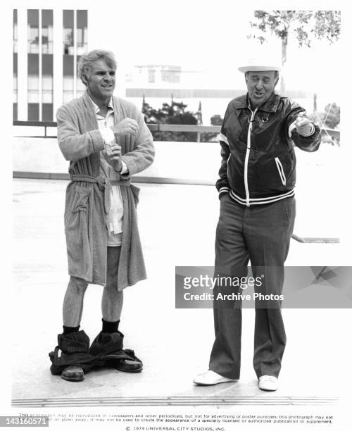 Steve Martin with pants down stands with director Carl Reiner in a scene from the film 'The Jerk', 1979.