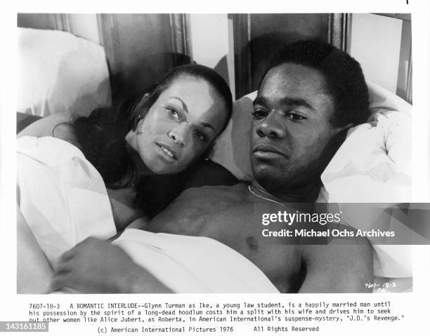 Alice Jubert in bed with Glynn Turman in a scene from the film 'J.D.'s Revenge', 1976.