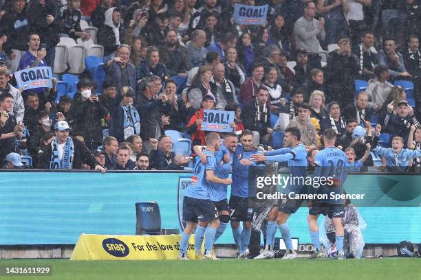 Robert Mak of Sydney FC ccelebrates kicking a goal with team mates during the round one A-League Men's match between Sydney FC and Melbourne Victory...