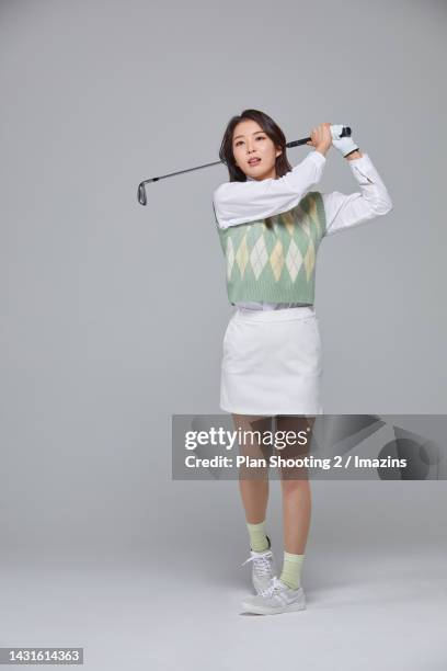 women, generation mz, golfer, fashion, iron, swing - woman on swing foto e immagini stock