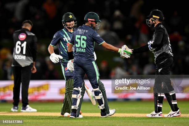 Babar Azam of Pakistan and Devon Conway of New Zealand shake hands during game two of the T20 International series between New Zealand and Pakistan...