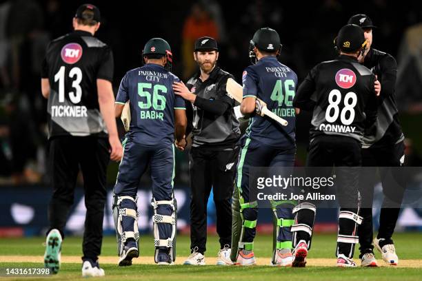 Babar Azam of Pakistan and Kane Williamson of New Zealand shake hands during game two of the T20 International series between New Zealand and...