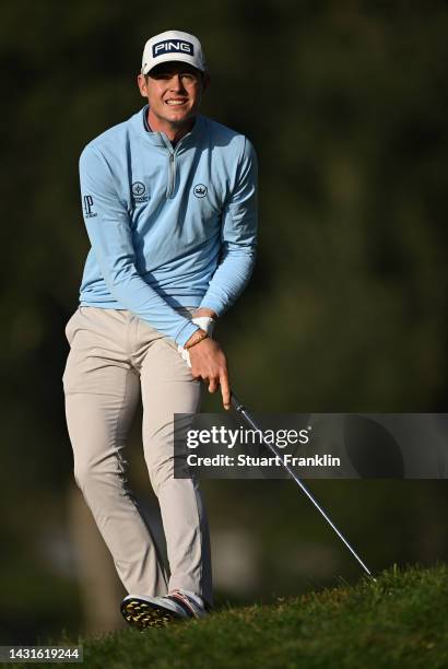 Wilco Nienaber of South Africa plays his approach shot on the firsrt hole during Day Three of the acciona Open de Espana presented by Madrid at Club...