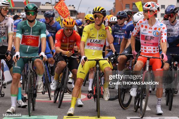Cofidis' French rider Victor Lafay wearing the best sprinter's green jersey , UAE Team Emirates' British rider Adam Yates wearing the overall...