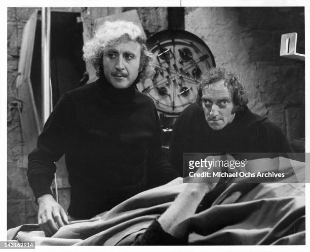 Gene Wilder and Marty Feldman standing over body in a scene from the film 'Young Frankenstein', 1974.