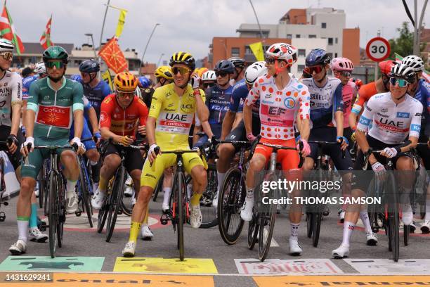 Cofidis' French rider Victor Lafay wearing the best sprinter's green jersey, UAE Team Emirates' British rider Adam Yates wearing the overall leader's...