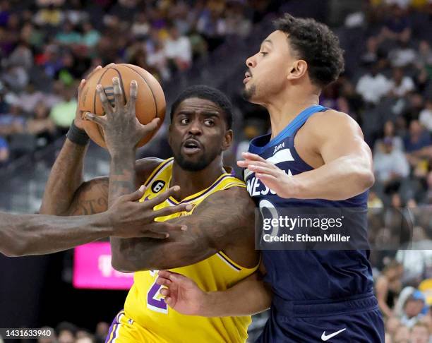 Dwayne Bacon of the Los Angeles Lakers drives against Bryn Forbes of the Minnesota Timberwolves in the third quarter of their preseason game at...